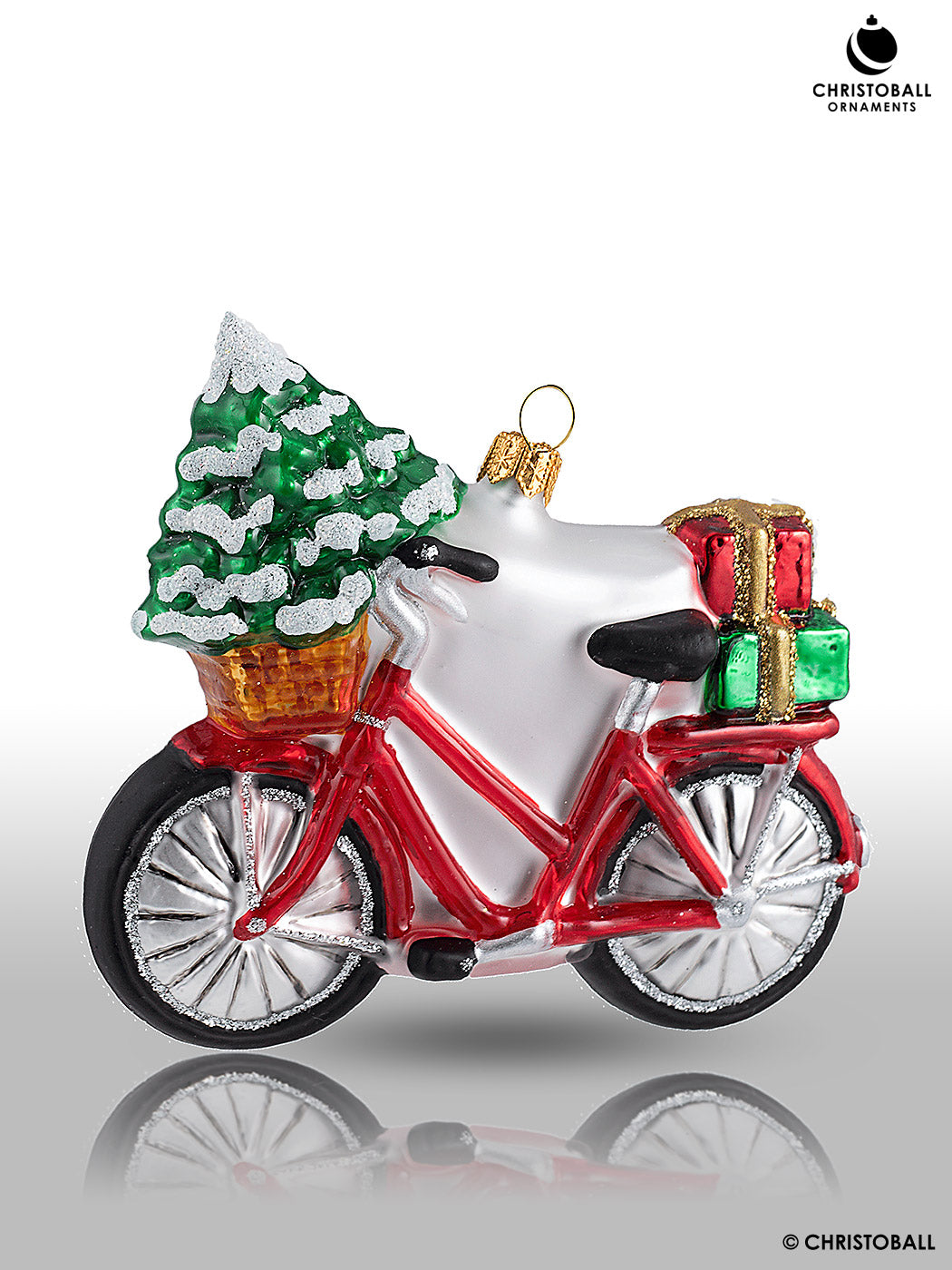 Fahrrad mit Geschenken und Tanne